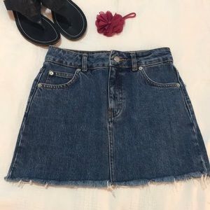 Topshop jean denim mini skirt. Size 0 Petite. Raw hem. Excellent condition.